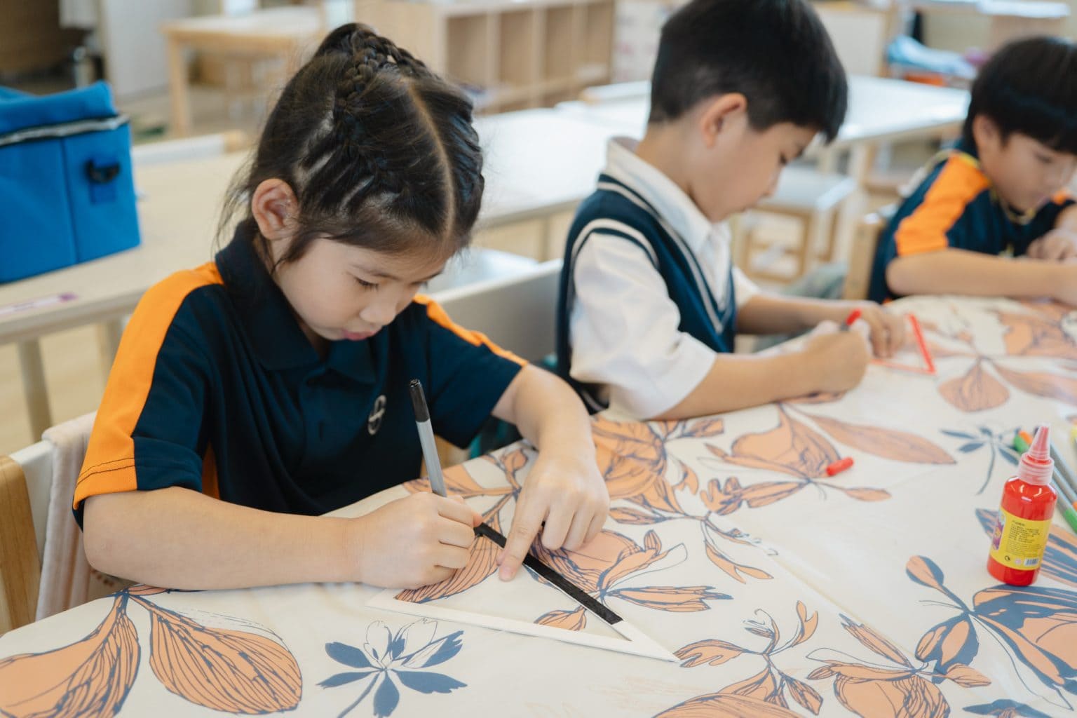 Year 1 pupils drawing patterns in art