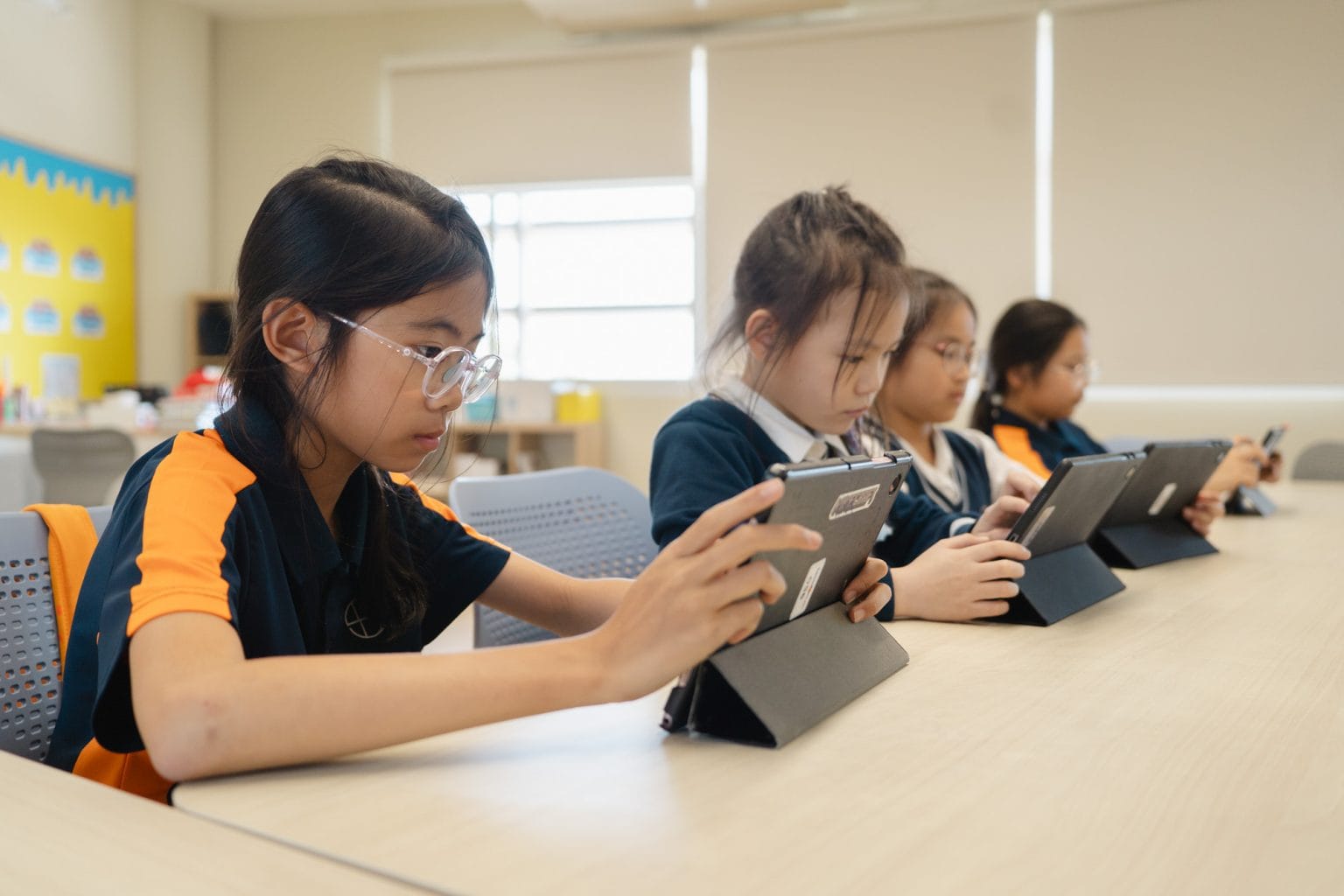 Pupils using tablets in a computing lesson