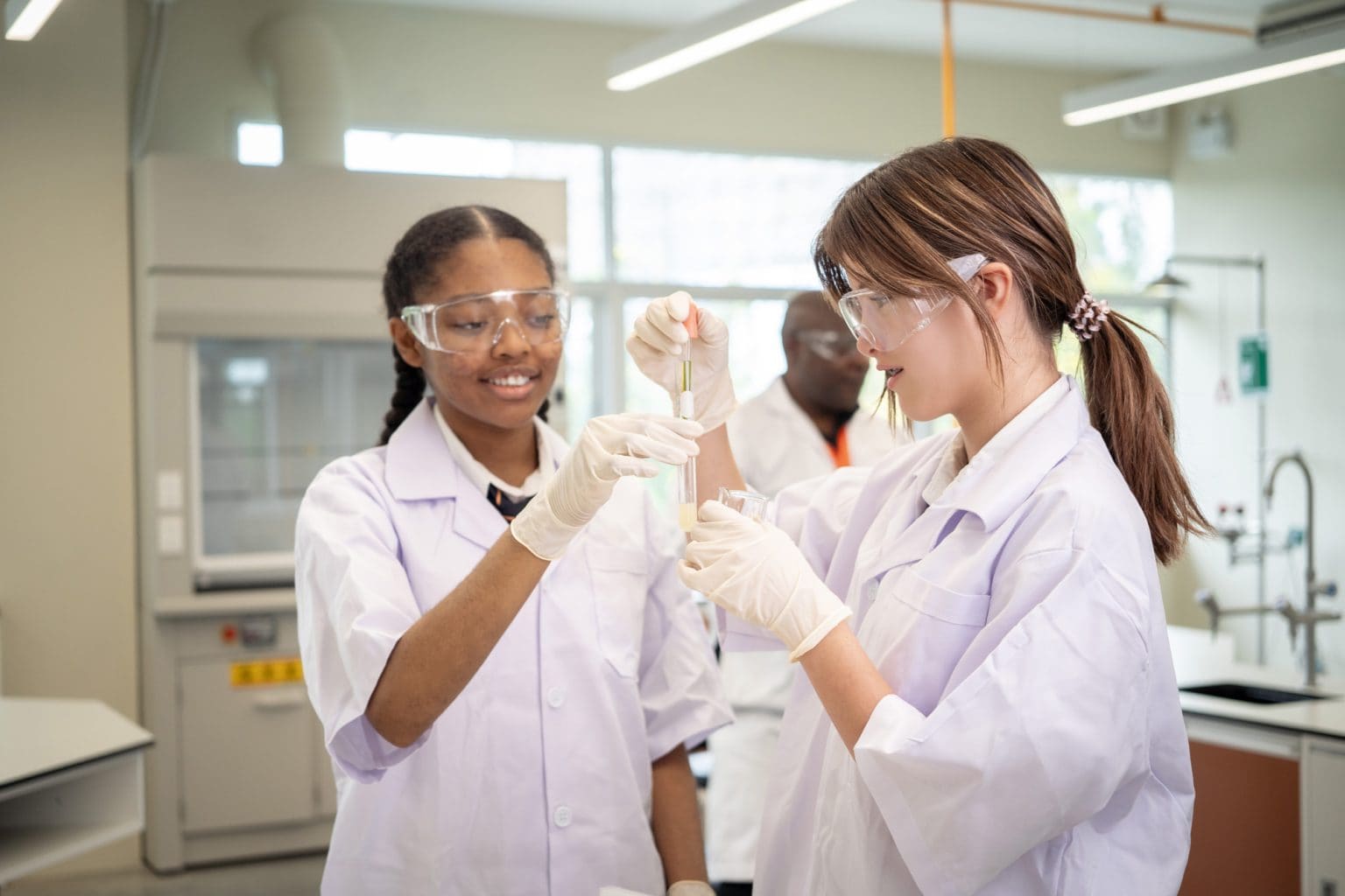 Two students carrying out an experiment in the science lab