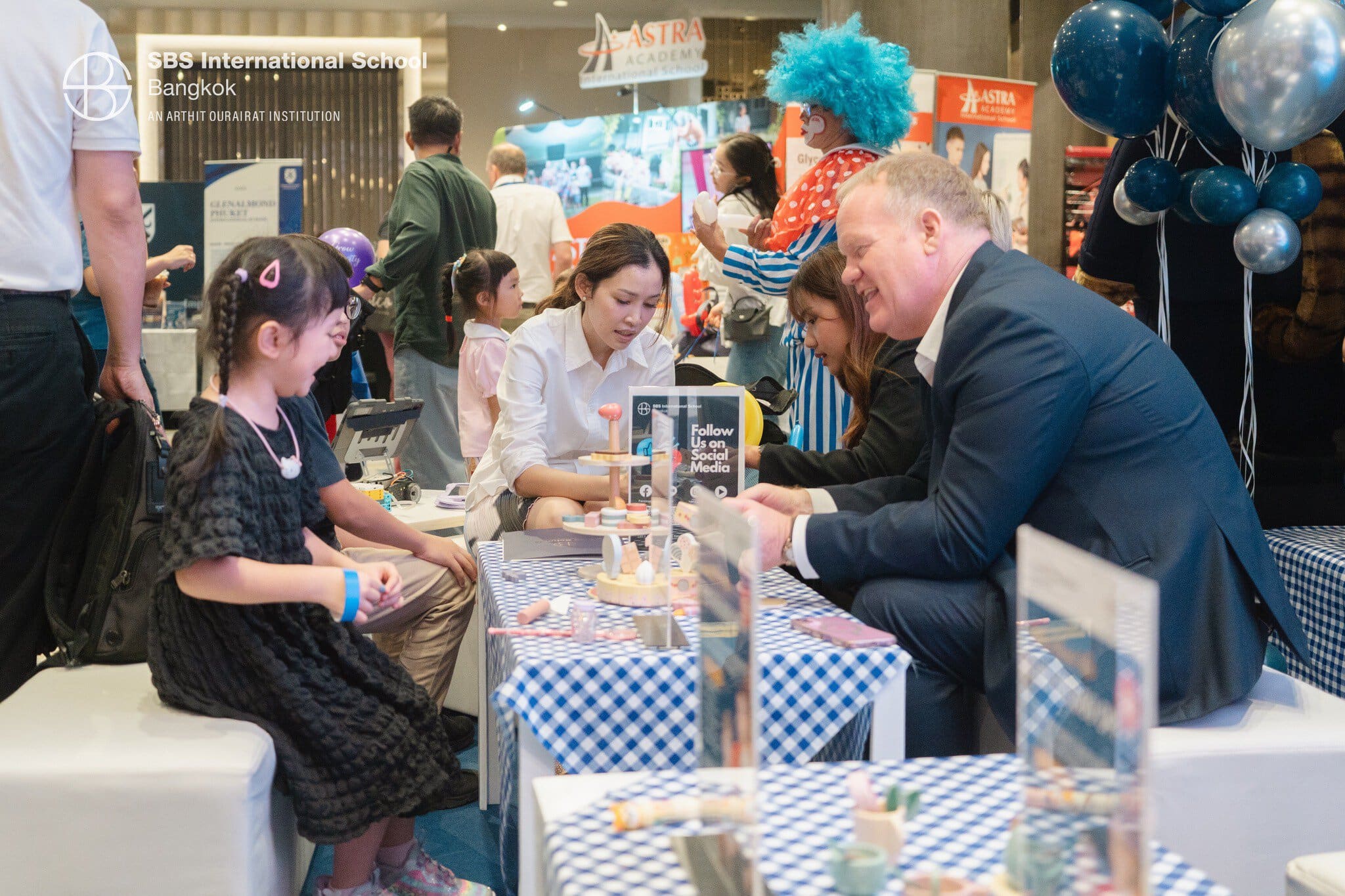SBS Bangkok representatives engaging children and parents at the education fair.