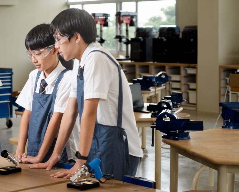 Students soldering in Design Innovation