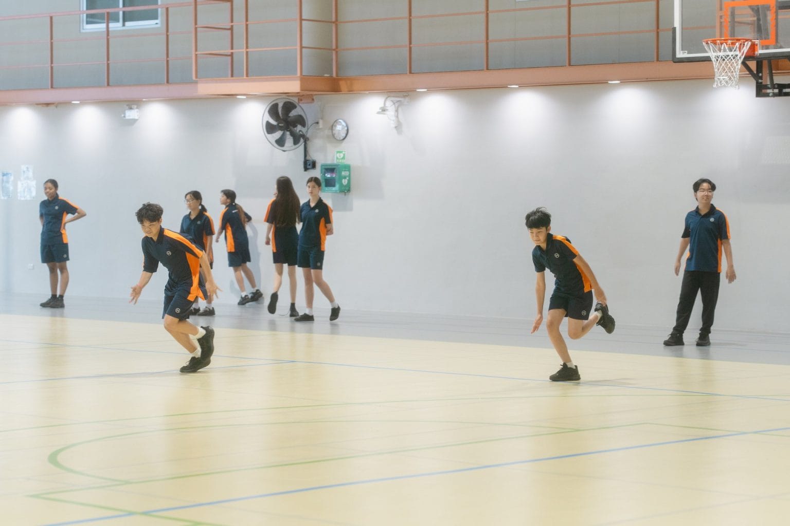 Year 9 students running drills in a PE lesson